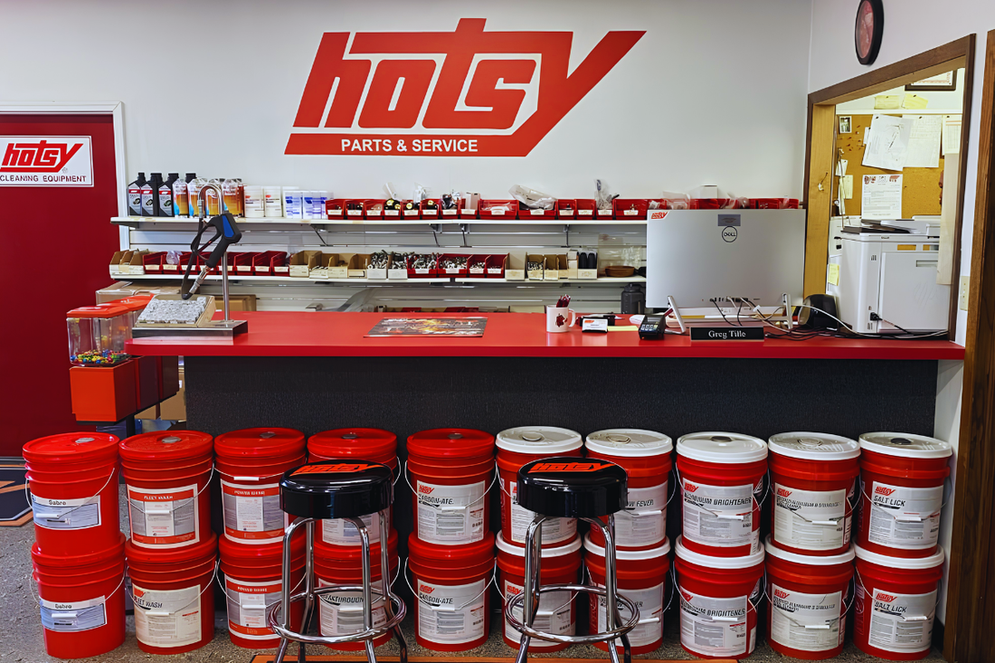 Hotsy detergents stacked in front of the service counter at Hotsy Equipment Company
